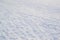 Trampled light white snow, footprints texture.  Snowy park. Minimalism