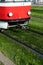 Tramway Drives On Iron Rails Through Green Grass