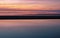 Tranquil abstract seascape over the horizontal sand bars and clam trees in the Rock Harbor shore on Cape Cod