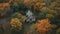 Tranquil autumn landscape old chapel on mountain in rural forest generated by AI