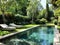 Tranquil backyard oasis with pool and lush greenery