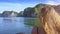 Tranquil Bay and Cliffs against Sky and Backside Girl View