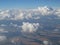 Tranquil Beautiful View From Plane Window at Blue Sky over White Clouds