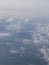 Tranquil Beautiful View From Plane Window at Blue Sky over White Clouds