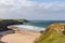 Tranquil beauty of Durness Beach, secluded bay bordered by cliffs, in Scotland