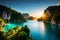 A tranquil blue lagoon nestled between towering limestone cliffs, with lush greenery