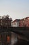 Tranquil body of water with a bridge and vibrant buildings on the shore. Berlin, Germany.