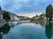 Tranquil canal in a bustling city street, with a bridge in Luzern, Schweiz