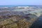 Tranquil and clear sea water with stones and seaweed in Acre, Israel