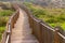 Tranquil Coastal Path with Wooden and Rope Fence at Beach, Guinch, Cabo da Roca.