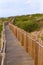 Tranquil Coastal Path with Wooden and Rope Fence at Beach, Guinch, Cabo da Roca.