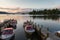 Tranquil dusk scene of Boats moored in piers in Lake Windermere