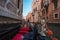 Tranquil Gondola Gliding Along Venice Canal, Capturing Serene Beauty of Italian Summer