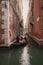 Tranquil Gondola Ride Through Charming Venice Canal - Serene Waterway Travel Photography