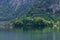 Tranquil Hallstatter See Lake surrounded by lush, emerald-green vegetation in Austria