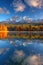 Tranquil high tatra lake in early autumn mountain sunrise and sky reflections in nature scene