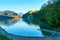 Tranquil lake in Alps with mountains on a background in the morning in autumn