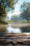 Tranquil Lakeside View with Misty Morning Light and Old Wooden Dock