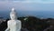 Tranquil landscape of huge monument of Buddha built on the top of ancient temple on mountain