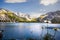 Tranquil Lunersee lake surrounded by lush green grass and jagged mountains in Austria