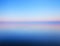 Tranquil minimalist landscape of calm water and horizon