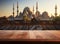 Tranquil mosque scene on a wooden table setting, ramadan and eid wallpaper