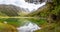 Tranquil mountain lake Mackenzie at the famous Routeburn Track, New Zealand