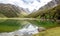 Tranquil mountain lake Mackenzie at the famous Routeburn Track, New Zealand