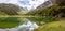 Tranquil mountain lake Mackenzie at the famous Routeburn Track, New Zealand