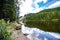 Tranquil mountain lake with reflections and tourist boat