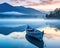 tranquil and mystical scene of a boat on a misty lake at dawn.