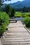 Tranquil outdoor setting with wood bench for contemplation on Soda Butte Creek, Yellowstone National Park, USA