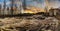 A tranquil panoramic view of river water flowing through the stones with dramatic cloud movement in the sky long exposure