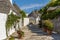 A tranquil, picturesque street of traditional Trulli buildings in Alberobello, Italy