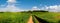 Tranquil Rural Landscape with Green Meadow and Vast Sky