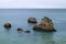 Tranquil scene of the rocks in the acean at the beautiful Ponta Joao de Arens in Portimao, Algarve