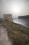 Tranquil scenery of Xlendi Tower in Xlendi Bay in Malta