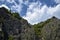 Tranquil scenic view of majestic rocky mountains against cloudy sky. Copy space.