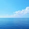 Tranquil sea harmony Blue sky over serene waters with reflection