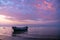 Tranquil sea with old fisherman boats at twilight