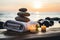 Tranquil sea stones balancing on wooden table with candle and towel spa and relaxation concept