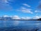 Tranquil seascape featuring a peaceful sea under a cloudy sky