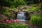 a tranquil and serene flower bed, with a peaceful waterfall in the background