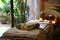 Tranquil spa scene with massage table, candles, towels, and flowers for a peaceful atmosphere
