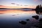 a tranquil, still lake at sunset