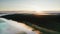 Tranquil Summer Dawn. Sunlight Softly Filtering Through Fog-Enshrouded River. Aerial Drone Shot
