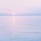 Tranquil sunrise or sunset over sea ocean calm waters