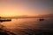 Tranquil Sunset over the Ocean with Silhouette of Boat. North Bali Indonesia.