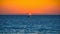 Tranquil sunset over water, nautical vessel silhouette, reflection and beauty generated by AI