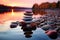 Tranquil sunset setting, Zen stones peacefully resting in shimmering water